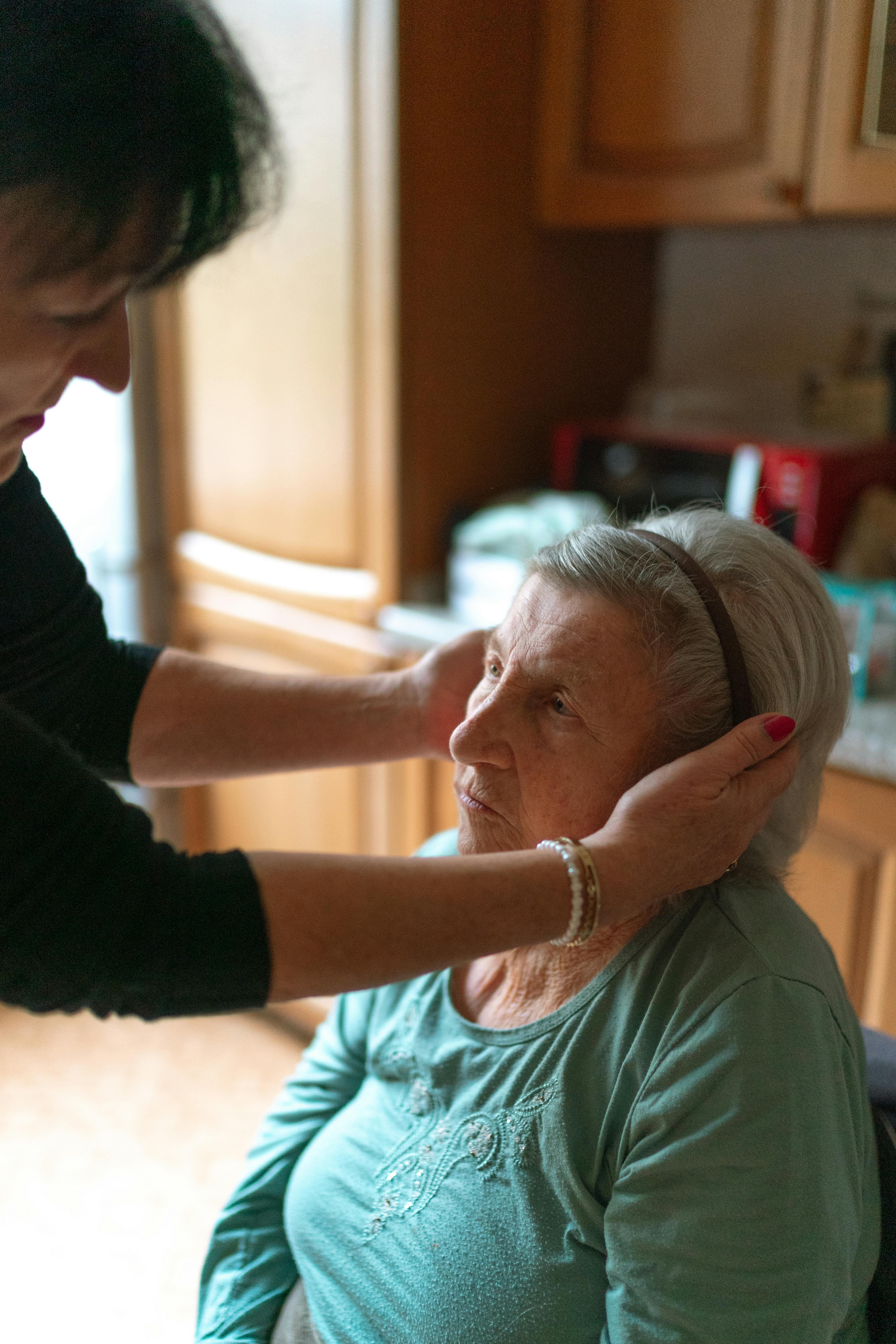 Caregiver supporting an older adult at home